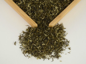Very small and curled dry leaves of Bi Luo Chun green tea.