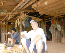 Austin drinking mao cha loose green puer tea in a village house.