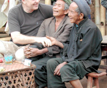 Austin with over 80 year old tea pickers, who have never worn shoes, but are still very happy with their lives.