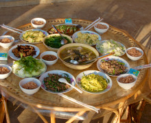 A table spread with several dishes of food.