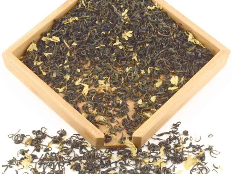 White Cloud Jasmine scented green tea dry leaves in a wooden display box.