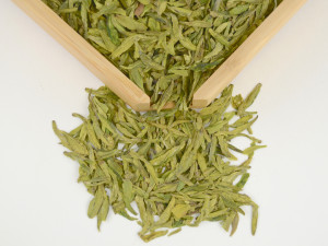 Distinctly yellow-green dry flattened leaves of Shi Feng Long Jing green Dragonwell tea