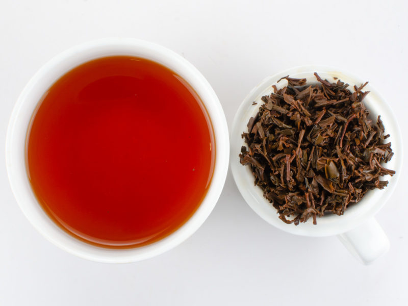 Cupped infusion of Breakfast Qimen (Breakfast Keemun) black tea and strained leaves.