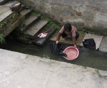 doing laundry in a river