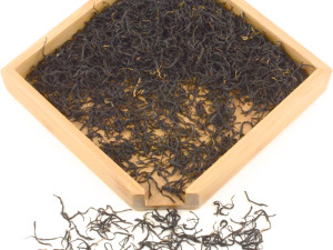 Thin, twisted leaves of Qimen Caixia black tea.