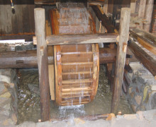 The wheel of a water-powered wooden tea kneading machine