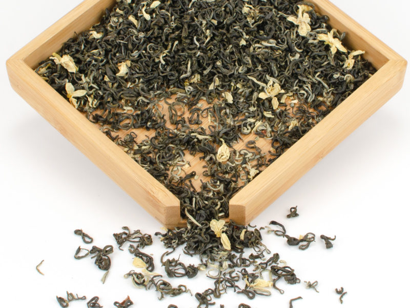 Bi Tan Piao Xue (Snow Drop Jasmine) scented green tea dry leaves in a wooden display box.