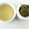 Huangshan Maofeng green tea and strained leaves.