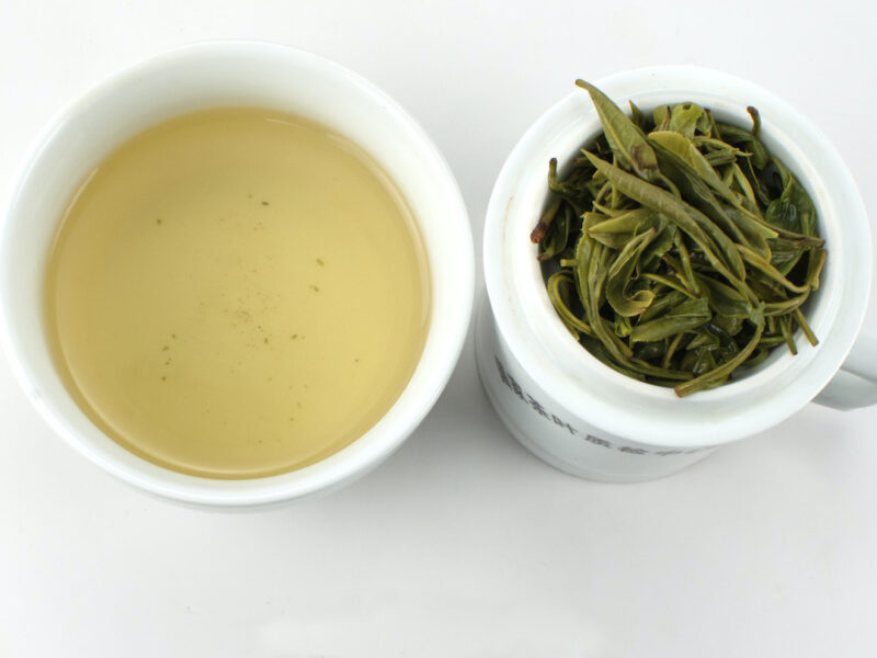 Huangshan Maofeng green tea and strained leaves.