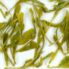 Tai Ping Houkui wet tea leaves floating in clear water.