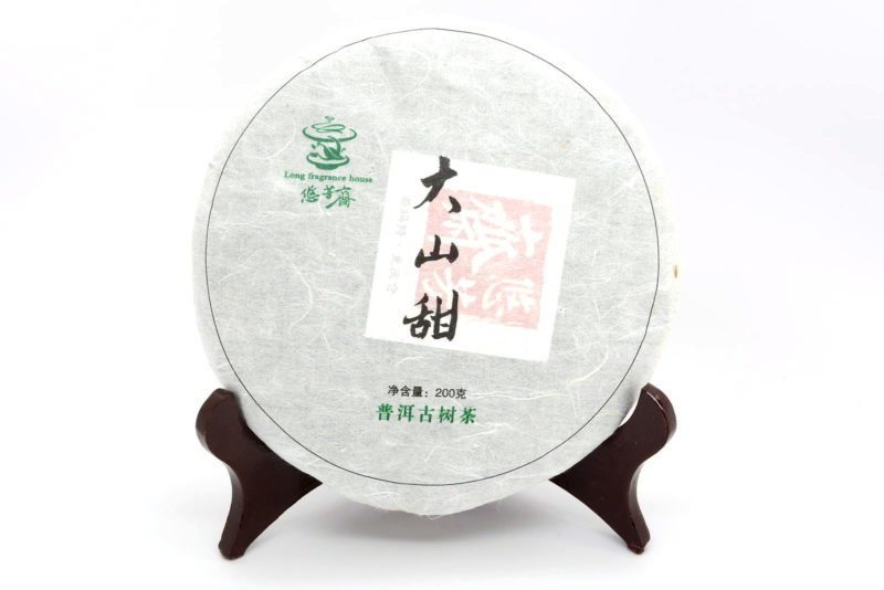 Da Shan Tian (Sweet Mountain) 2015 sheng puer cake in paper wrapper.