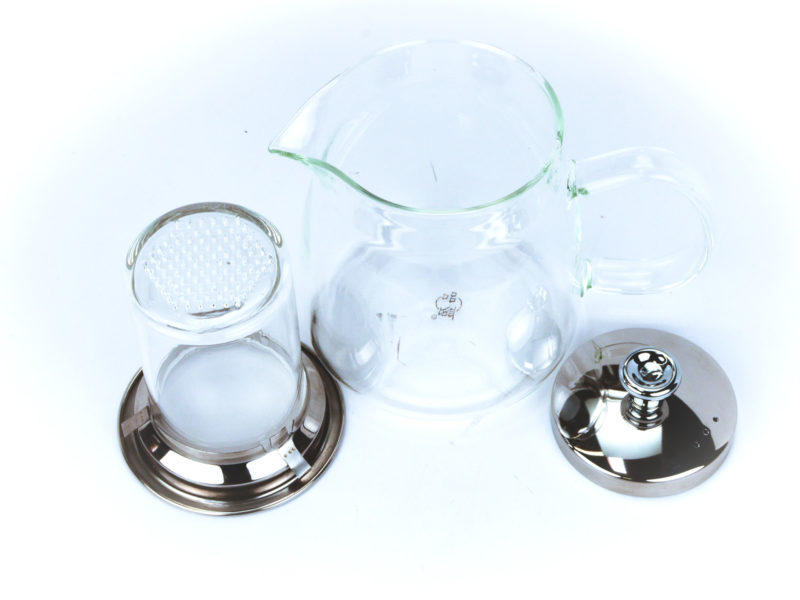 Small Glass Teapot with Glass Strainer with empty strainer removed to show perforations in bottom