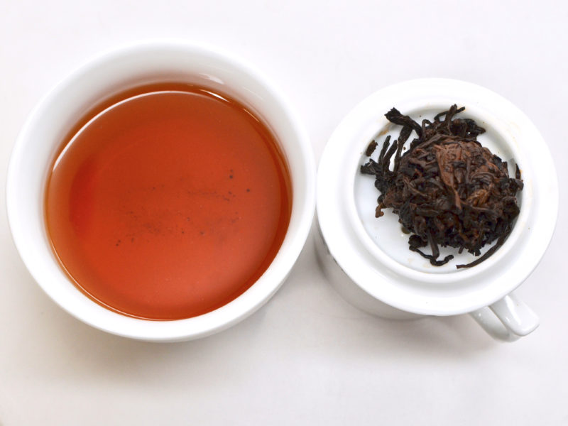 Shu Long Zhu (Sweet Dragon Ball) shu puer tea and strained leaves.