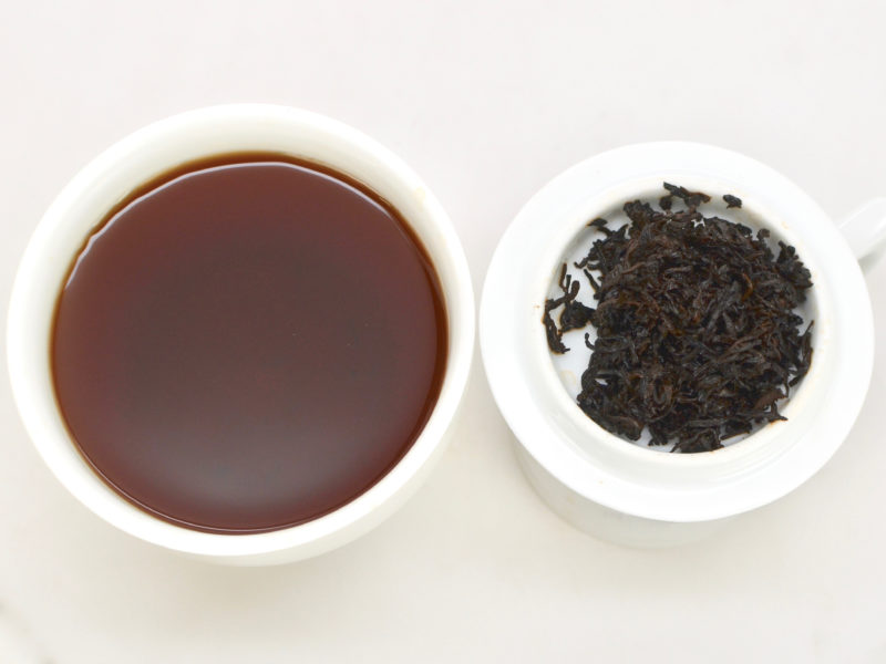 Zijuan Gongting (Purple Leaf Palace Puer) tea and strained leaves.