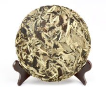 A compressed round cake of white moonlight tea