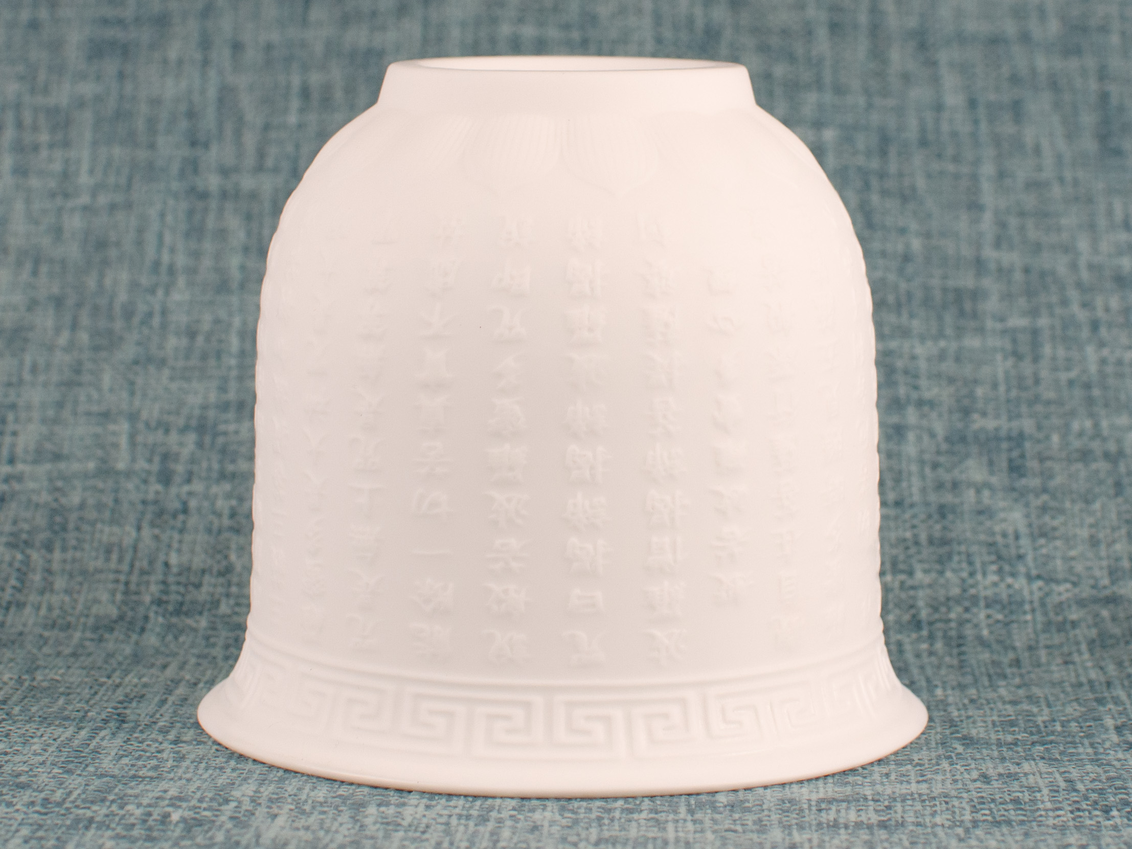 Heart Sutra Relief White Jade Porcelain Teacup detail view of base