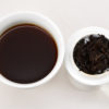 Gongting (Palace Puer) shu puer tea and strained leaves.