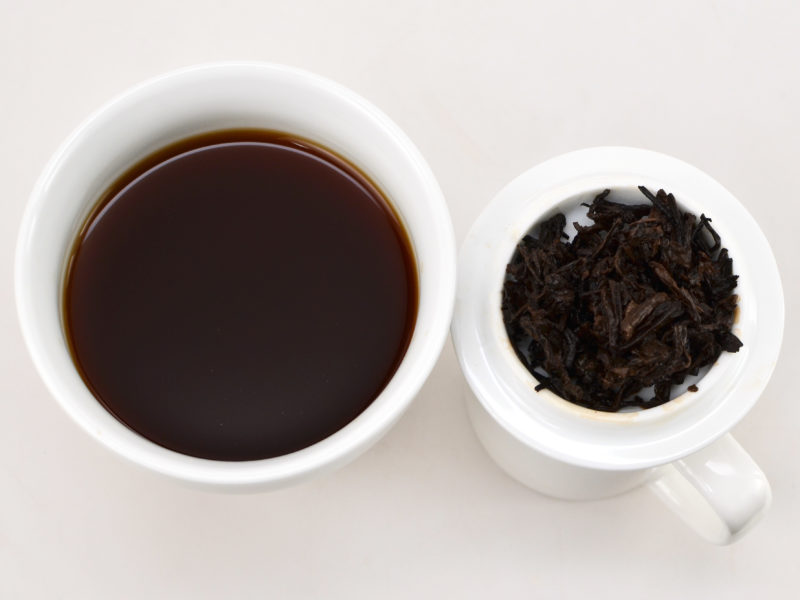 Gongting (Palace Puer) shu puer tea and strained leaves.
