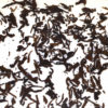 Gongting (Palace Puer) wet tea leaves floating in clear water.
