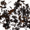 Jujube shu puer brick wet tea leaves floating in clear water.