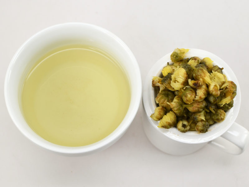 Tai Ju baby chrysanthemum infused tea and strained leaves.