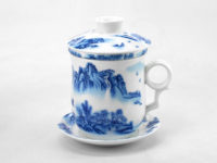 Side view of mountain scene painted on side of landscape porcelain filter cup.