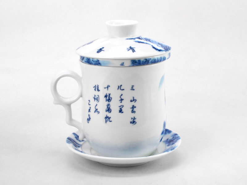 Side view of calligraphy painted on side of landscape porcelain filter cup.