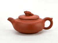 Side view of lucky toad yixing clay pot.