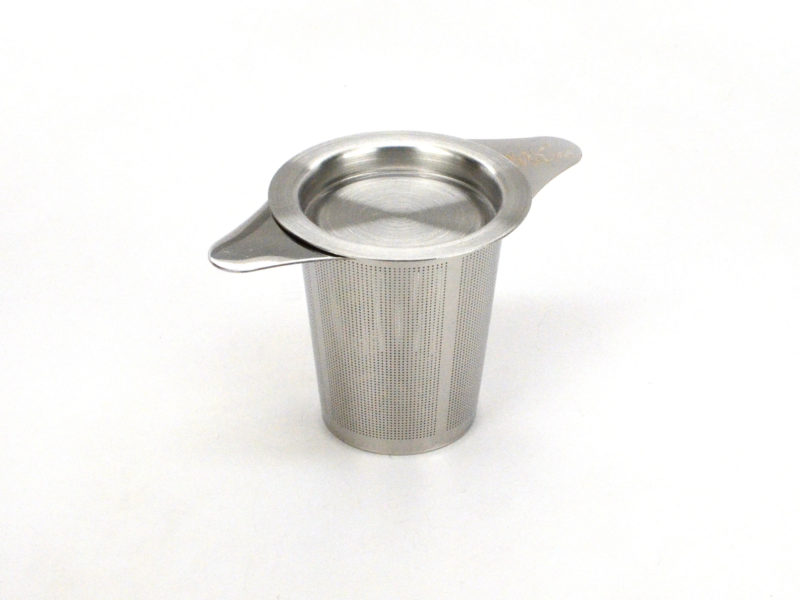 Stainless steel strainer with saucer being used as a lid.