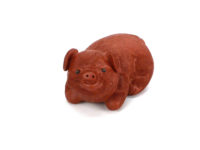 Happy piggy yixing clay tea pet, smiling and facing viewer.