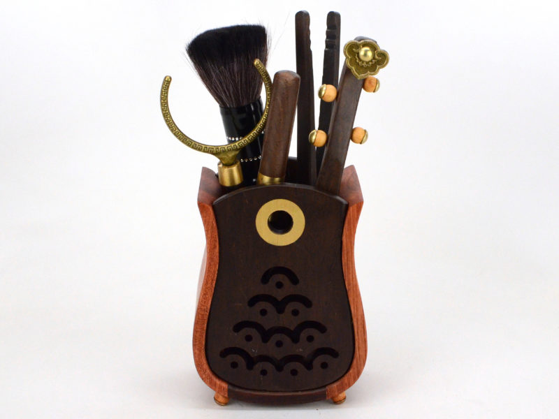 Musical instrument ebony tea utensil set in vase.