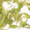 Mountain Forest Huangshan Maofeng green tea leaves floating in clear water.