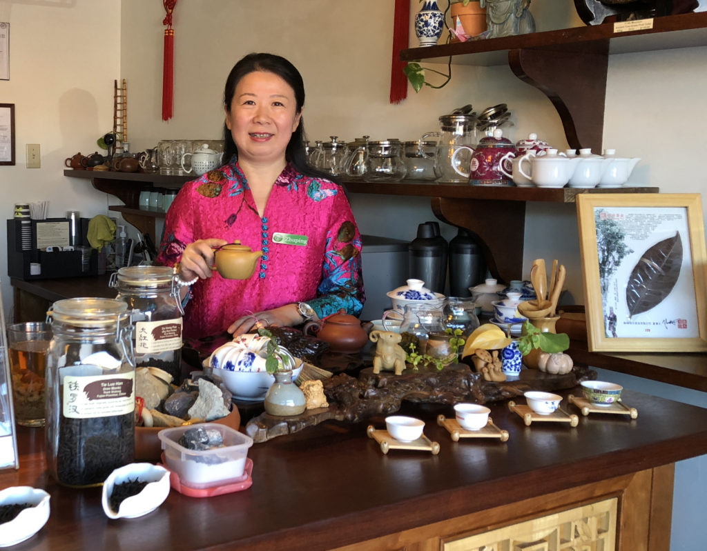 Zhuping hosting a tea tasting at the teahouse