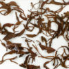 Zijuan Hong (Yunnan Purple Leaf Black) wet tea leaves floating in clear water.
