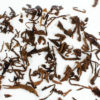 Cha Tao wet tea leaves floating in clear water.
