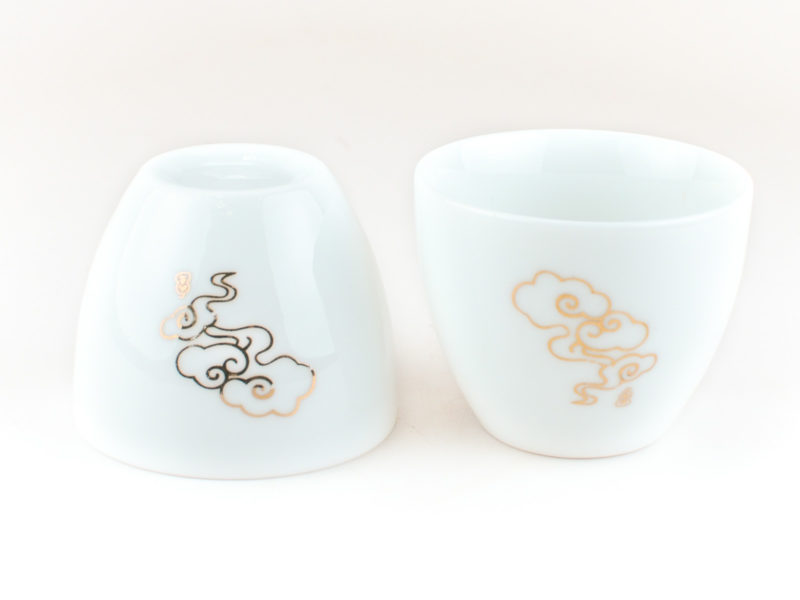 Two Lucky Clouds White Porcelain Teacups, one inverted to show base
