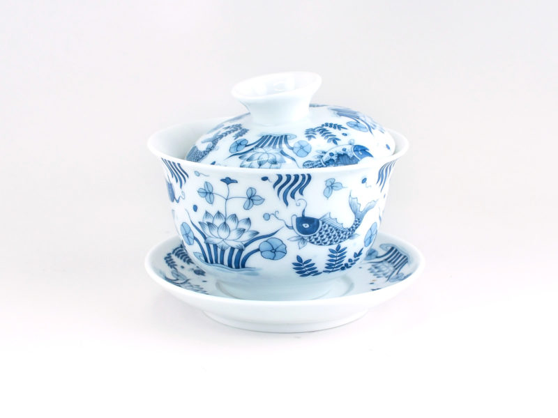 A Blue and White Fish Gaiwan viewed from the side.