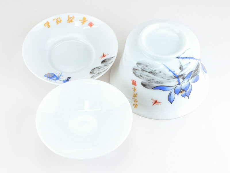 Large Gaiwan with Bluebird and Lotus disassembled and viewed from above to show the pattern on the saucer and bowl and the plain inside of the lid.