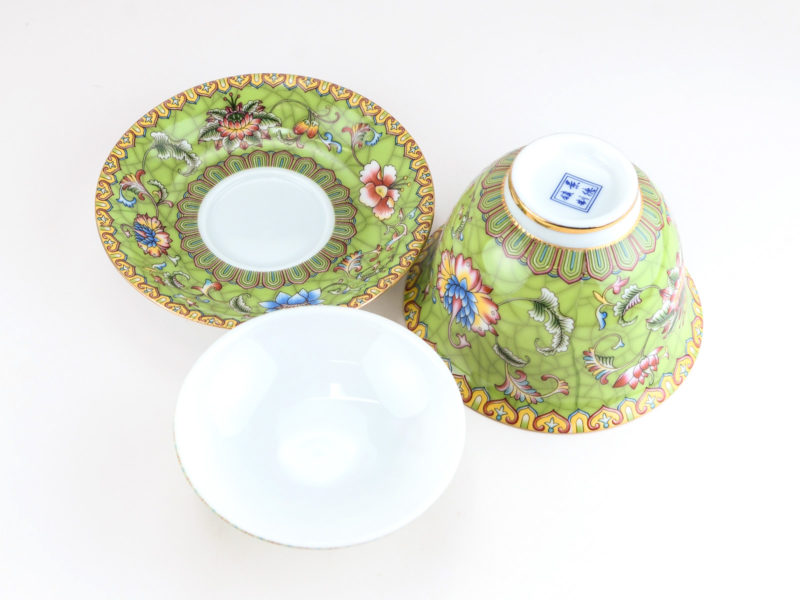 Enamel Green Gaiwan disassembled and viewed from above to show the pattern on the saucer and bowl and the plain inside of the lid.