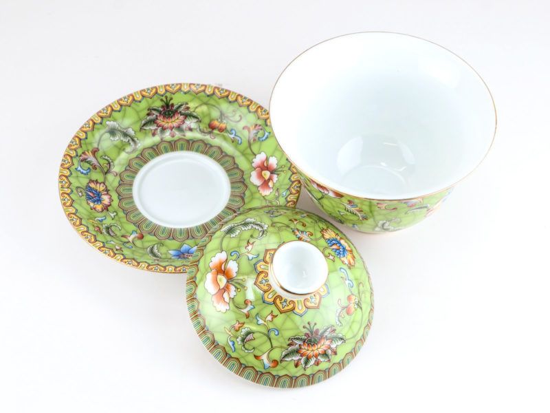 Enamel Green Gaiwan disassembled and viewed from above to show the pattern on the saucer and lid and the plain inside of the bowl.