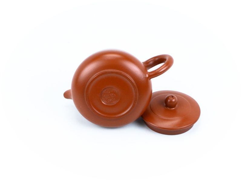 The maker's stamp on the bottom of the Red Hua Yun Yixing Teapot