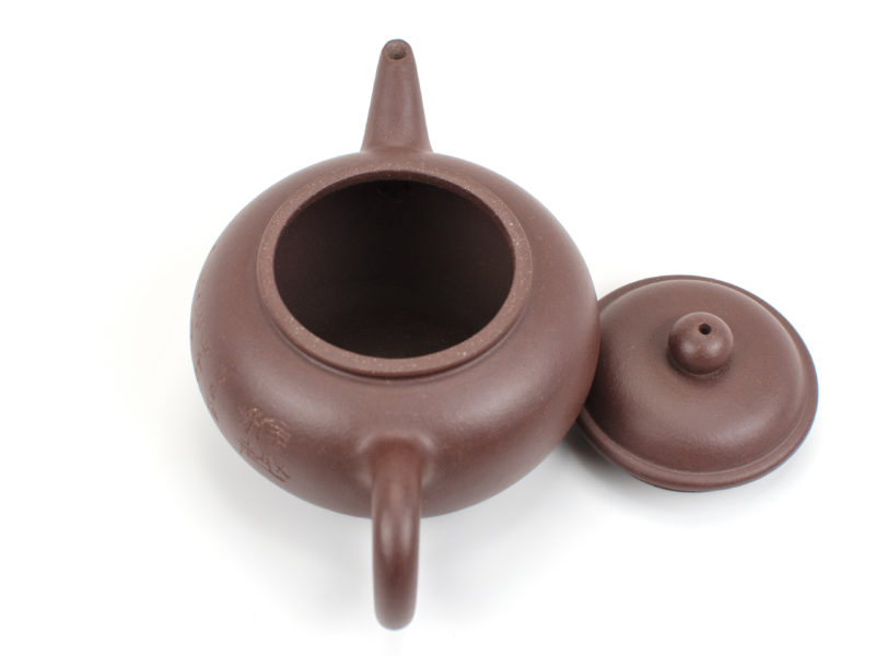 Purple Shui Ping Yixing Teapot with lid open to show the strainer inside behind the spout.
