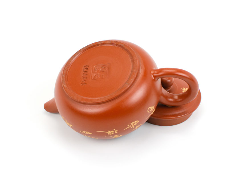 Maker's stamp on the base of the Red Plum Blossom Painted Yixing Teapot.