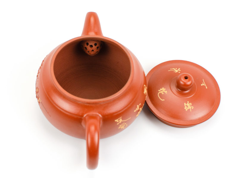 Red Plum Blossom Painted Yixing Teapot with lid open to show the strainer bulb behind the spout.