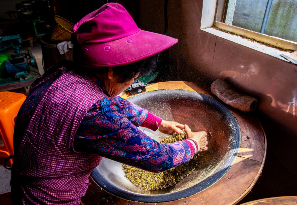 Wang Xiangzhen making tea in Moganshan. A rare female tea maker, Ms. Wang is famous for her green and yellow teas.