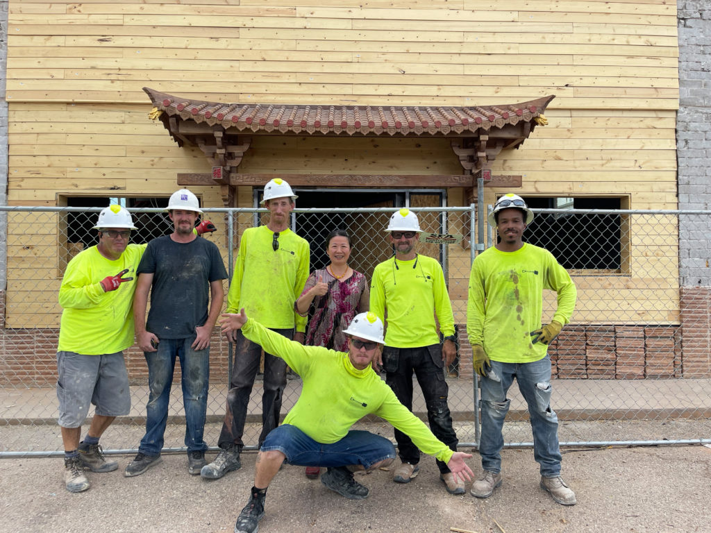Zhuping visiting the construction team at the new teahouse.