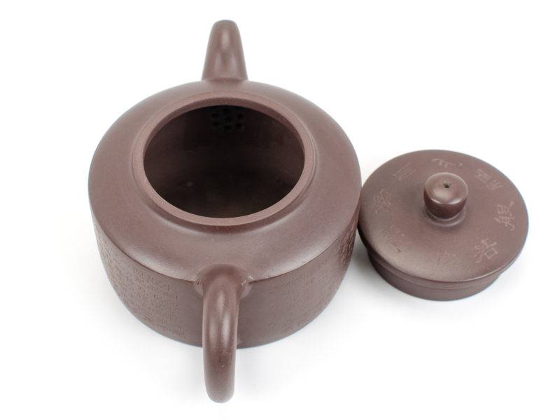 Purple Heart Sutra Yixing Teapot with lid open to show strainer behind spout