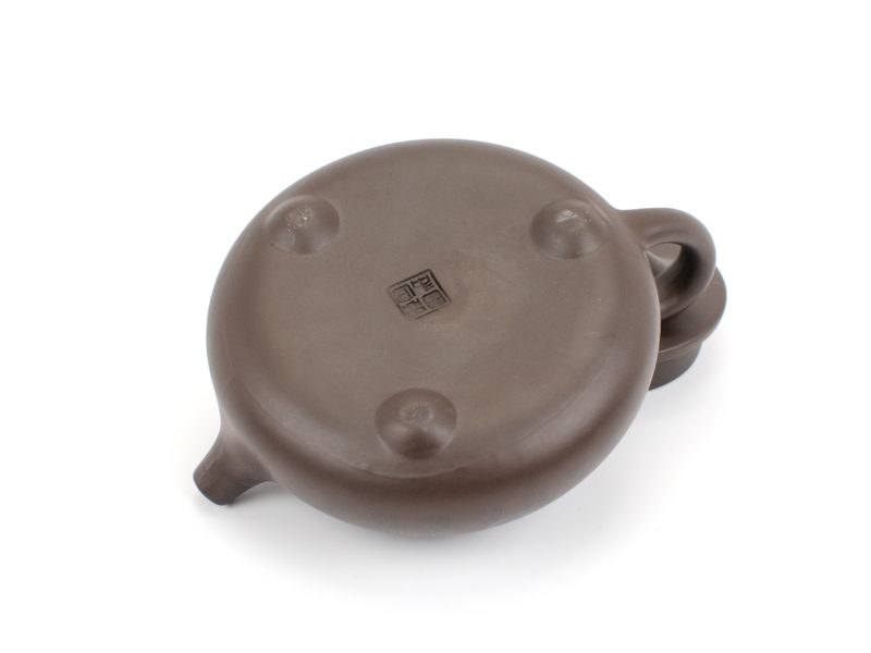 View of maker's stamp and three feet on base of the Purple Shi Piao Good Fortune Yixing Teapot