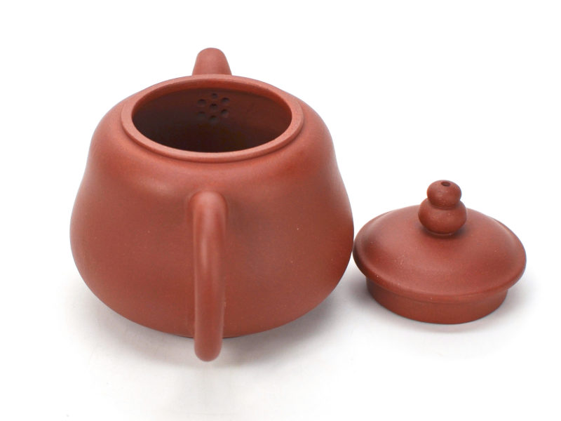 Red Gourd Yixing Teapot with lid open to show the strainer behind the spout.