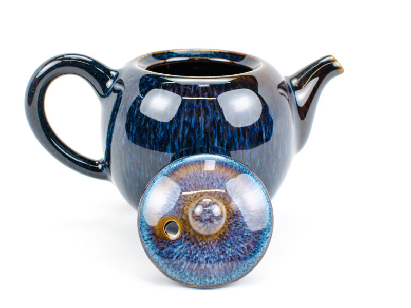 Detail view of lid of Jun Kiln Round Blue Ceramic Teapot.
